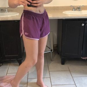Purple”The North Face” athletic shorts.
